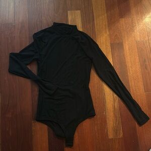 Women’s size XS black long sleeve mesh and Cotten bodysuit.